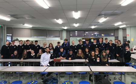 Students from Terenure Presentation College sit with a member of staff from Dublin Simon. They are handing over vouchers for the rough sleepers of Dublin City.